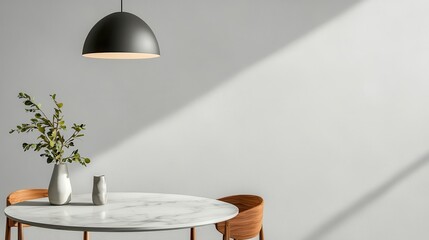 Modern dining area with a round marble table, minimalist chairs, and a pendant light, simple elegance in neutral tones