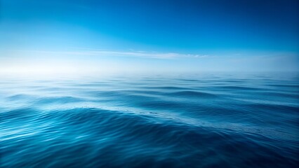 Obraz premium Vast Ocean Surface, Mist, Waves, Blue Sky, Calm Sea, Horizon, Serenity, Tranquility, Nature, Seascap