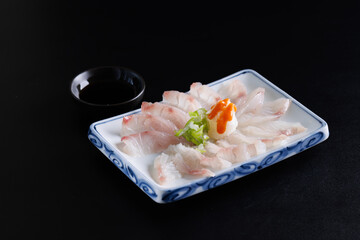 Sea bream sashimi Japanese food Japanese seafood isolated in black background