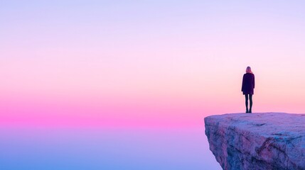 Fototapeta premium Courageous Exploration, a woman's silhouette stands boldly on a cliff's edge at sunrise, embodying the spirit of adventure and the beauty of new beginnings.