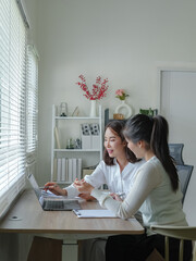 Asian Bussiness woman using laptop consult business finance strategy.