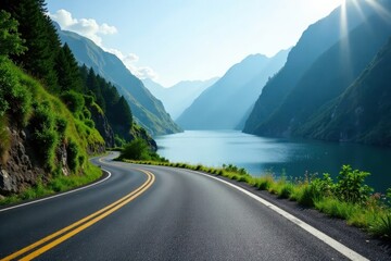 Fototapeta premium Scenic Winding Asphalt Road Beside a Serene Mountain Lake with Lush Green Foliage