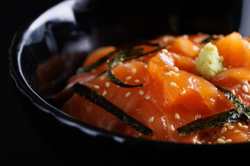 Salmon Sashimi Bowl Donburi japanese food isolate in black background