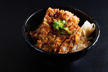 Chicken tonkatsu with rice japanese food isolate in black background