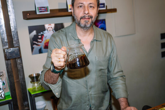 Barista Presenting Freshly Brewed Specialty Coffee with Care