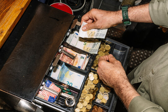 Cash Register in a Coffee Shop with Euro Banknotes and Coins