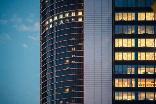 Urban Skyscraper Windows Illuminated in Evening Light