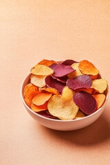 top-down view of scene is product photography setup with studio lighting snack bowl filled with colorful vegetable