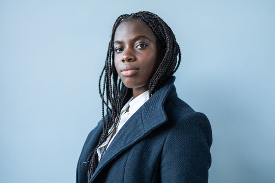 African American businesswoman with braids in a professional setting