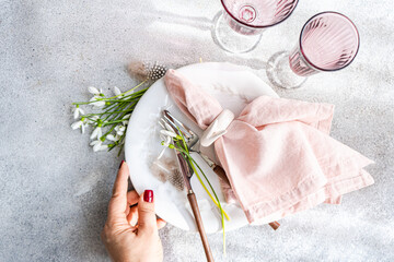 Elegant spring table setting with fresh snowdrops