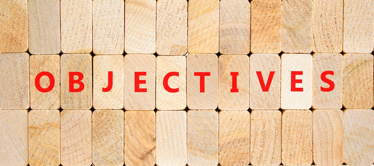 Objectives symbol. Concept word Objectives on beautiful wooden blocks. Beautiful wooden blocks...