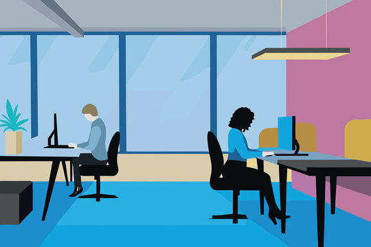 Two professionals are focused on their tasks in a contemporary office environment