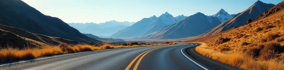 Naklejka premium Empty asphalt road curves through majestic mountains , valley, serene, hills