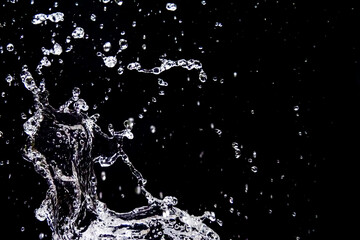 Dynamic Splash of Water Droplets Against a Black Background Capturing Motion and Fluidity in High-Speed Photography