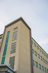 Looking up a postmodern factory building.