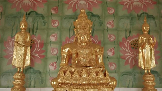 Buddhist temple interior revealing golden buddha statues, symbolizing sacred spiritual traditions and artistic craftsmanship