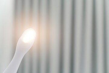 close-up of advanced imaging wand for ultrasound scanning bright led indicators glowing against smooth surface blurred