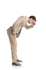 smart casual man waiting in line is leaning forward