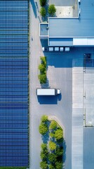 Aerial View of Sustainable Logistics: Solar Panels, Warehouse, and Delivery Truck