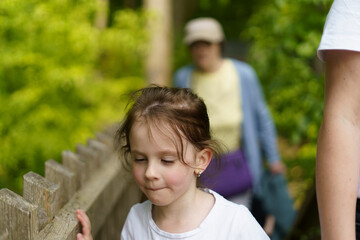 A large family of different ages on active recreation in a summer park. Concept of active family leisure