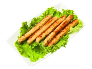 Prepared grilled sausages and green salad leaves