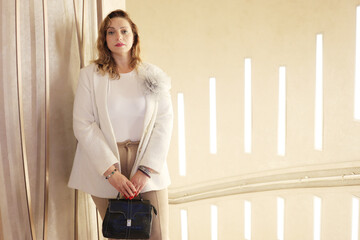 Portrait of a woman in an expensive interior.