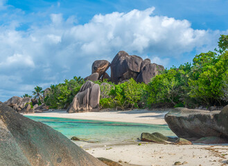 Granite boulders and white sand in a tropical beach
