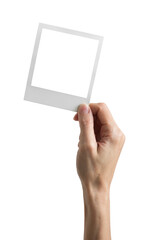 Vintage Polaroid mockup in hand - clipping path, Studio shot of instant photo frame isolated in...