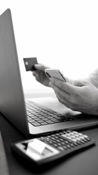 black and white video. man enters bank card details into phone and makes online purchases via internet. outdated payment systems require modernization and simple secure payment methods
