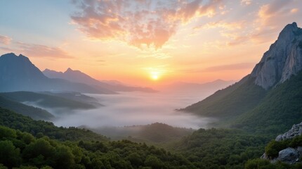 Obraz premium Misty Sunrise Over Green Valleys and Rugged Mountains