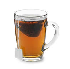 Tea bag in glass cup with hot drink isolated on white