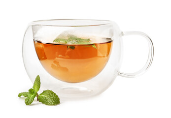 Tasty mint tea in cup and fresh leaves isolated on white