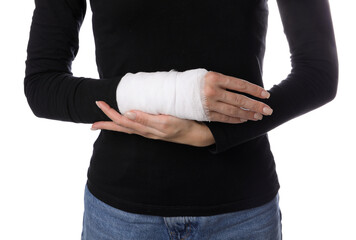 Woman with medical bandage on wrist against white background, closeup