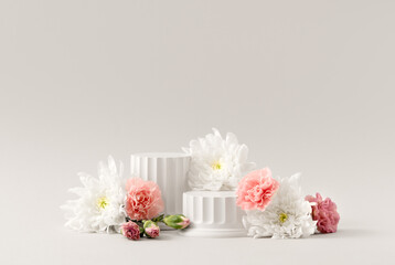 Beauty Cosmetics Product Presentation Podium made with White Columns and Natural Flowers on White...