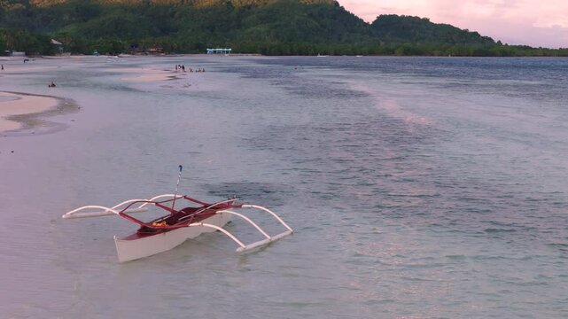 Cinematic clip of a banka boat on a beach in Anda, Bohol Philippines