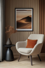 Frame Mockup  Stylish reading nook with textured chair | Beige armchair with orange accent pillow, black side table, dried flowers, and framed desert artwork, warm wood-paneled interior, cozy retreat.