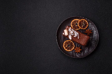 Piece of sweet chocolate bounty cake with coconut flakes and sponge