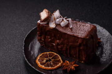 Piece of sweet chocolate bounty cake with coconut flakes and sponge