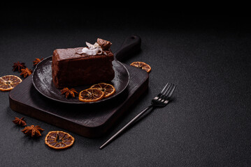 Piece of sweet chocolate bounty cake with coconut flakes and sponge