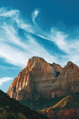 Obraz premium Imposing mountain peak standing tall in the desert landscape of Zion National Park, USA.