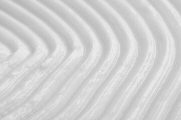 Face cream as background, closeup. Cosmetic product