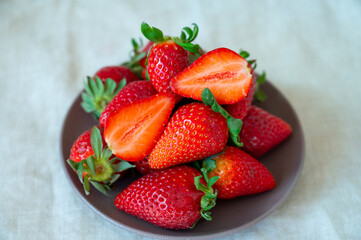 New harvest, plate with bio ripe red sweet strawberry from Tenerife, Canary islands, Spain,...