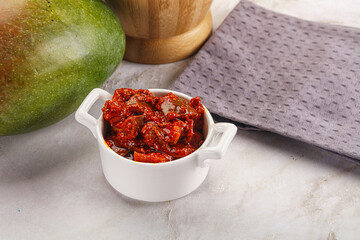 Spicy pickled raw green mango