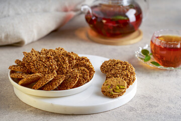 Traditional middle eastern sesam cookies barazek with arabic mint tea.