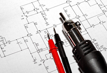 Red and black probes and a soldering hair dryer