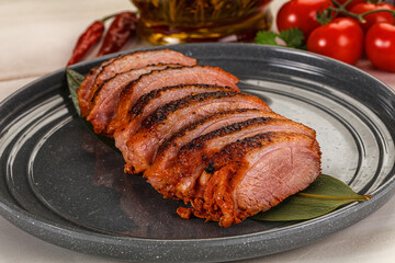 Sliced duck breast baked with cherry