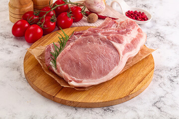 Raw potk loin steak with bone