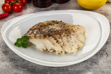 Baked cod fish fillet with spices