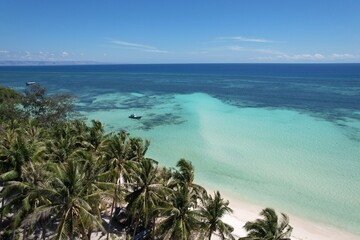beautiful beach views decorated with cliffs and many coconut trees