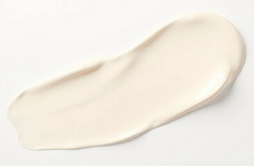 Fototapeta premium Top view. A smear of cream on a white background.